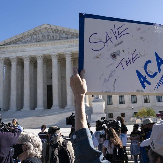 Save ACA sign in front of Supreme Court